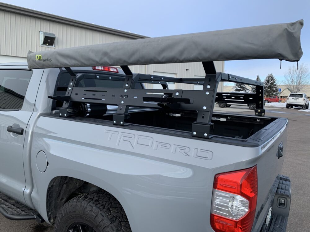 https://exitoffroad.com/wp-content/uploads/2023/09/RCI-12-inch-High-HD-Aluminum-Bed-Rack-1-scaled.jpeg