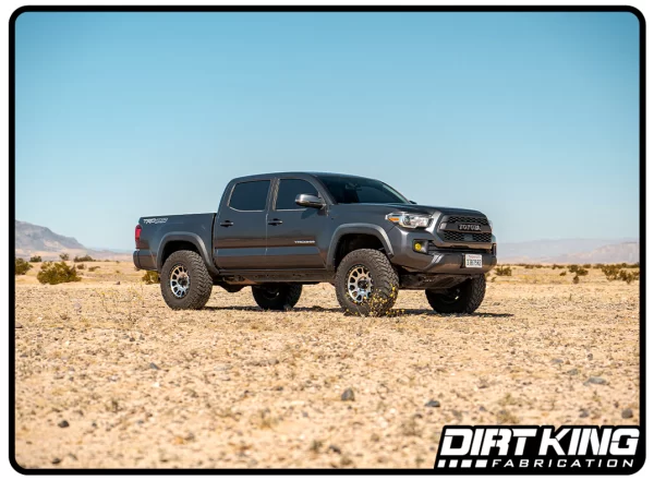 DK-811989F_dirt_king_toyota_tacoma_mid_travel_2.5_coilovers_paired_with_dirt_king_ball_joint_control_arms_front_side_shot_1400x